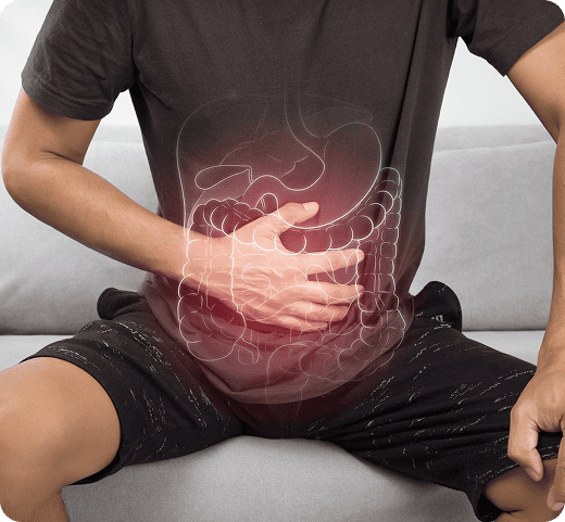 Person holding their abdomen with a digestive system illustration overlay, highlighting stomach and intestinal pain related to Bowel Cancer symptoms and gastroenterology care.